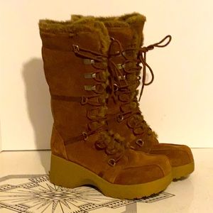 Brown suede platform lace up boots.